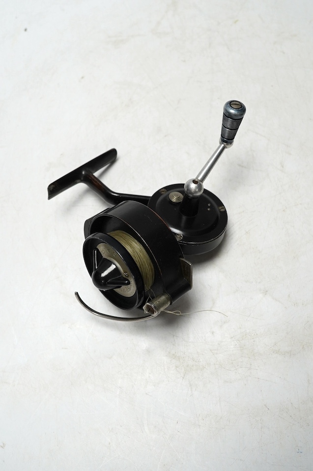 Four fishing reels, including a Bakelite Alcock Aerialite, an Elo, a Seprage C.A.P and a wooden reel, largest 10.5cm diameter. Condition - used, fair